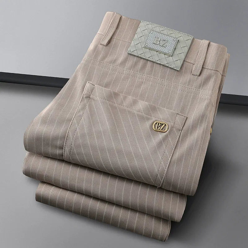 Close-up of premium, wrinkle-resistant men's woven striped trousers, highlighting fabric detail.