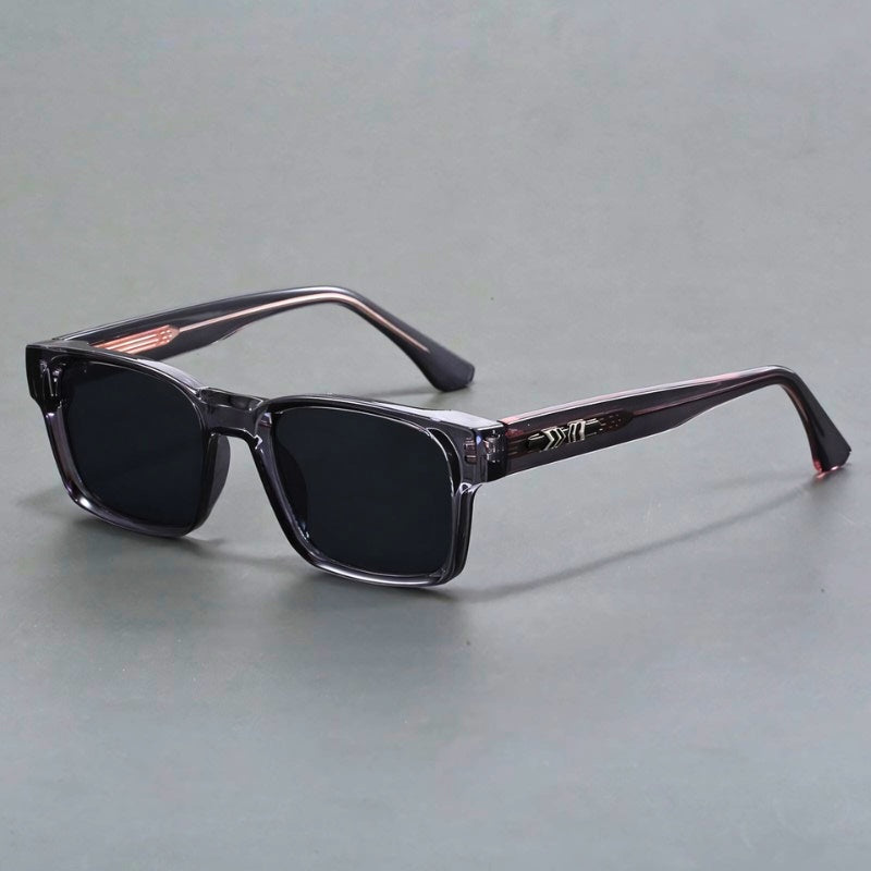 Close-up of men's elegant UV400 sunglasses, showing gradient lenses & durable frame. Anti-glare eye protection.