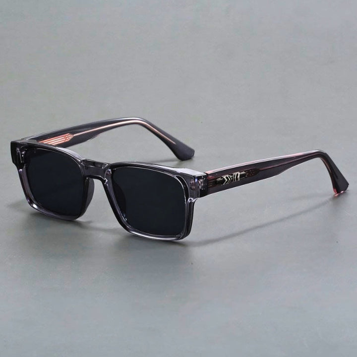Close-up of men's elegant UV400 sunglasses, showing gradient lenses & durable frame. Anti-glare eye protection.