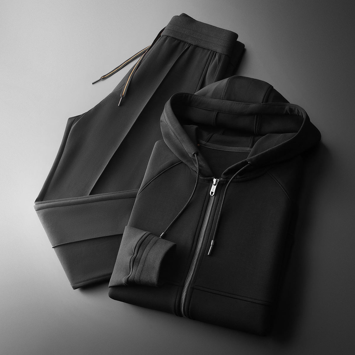 Man relaxing in a comfy men's loungewear tracksuit set, ultimate comfort for home style & casual wear.
