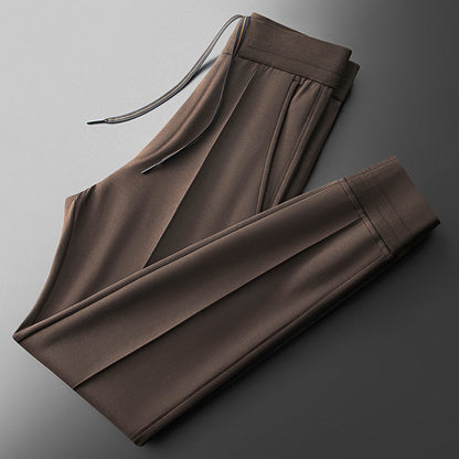Zipper & pocket detail on men's elite tracksuit jacket, ultimate comfort & functional athletic style.