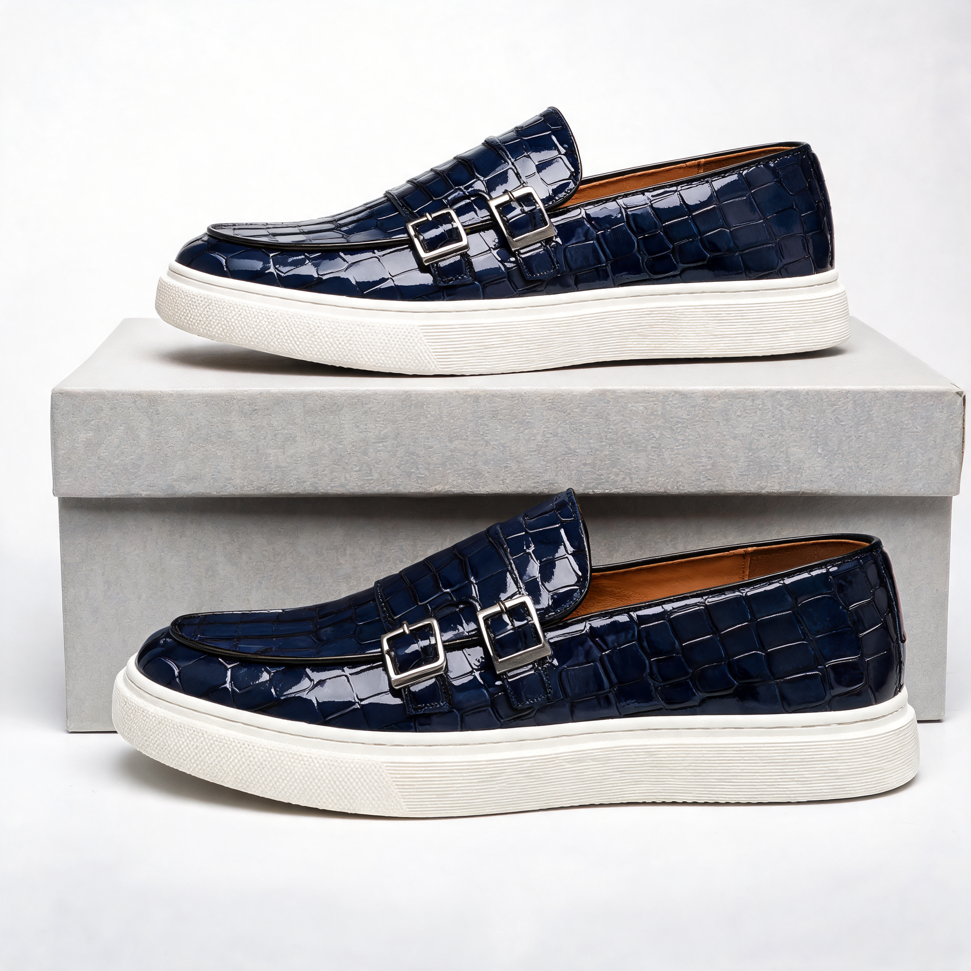 Stylish men's dress loafers: platform slip-ons with unique embossed texture and sophisticated buckle.