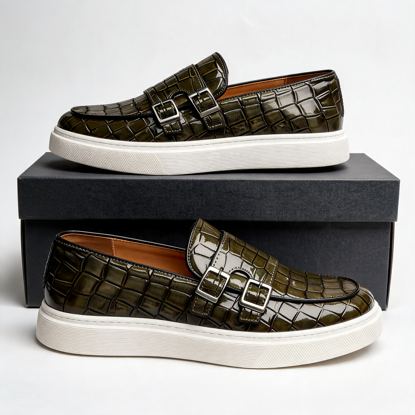 Modern men's platform loafers. Slip-on design, embossed finish, and buckle for comfortable, stylish luxury.