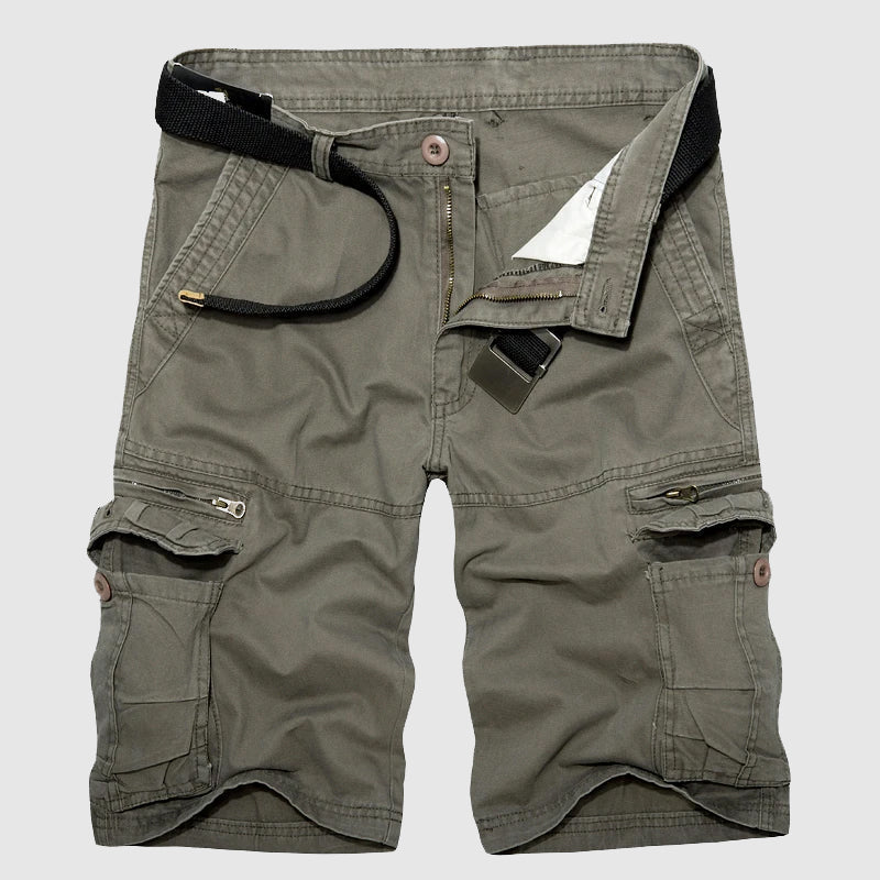 Close-up: Men's utility cargo shorts, highlighting spacious multi-pockets for travel essentials & adventure.