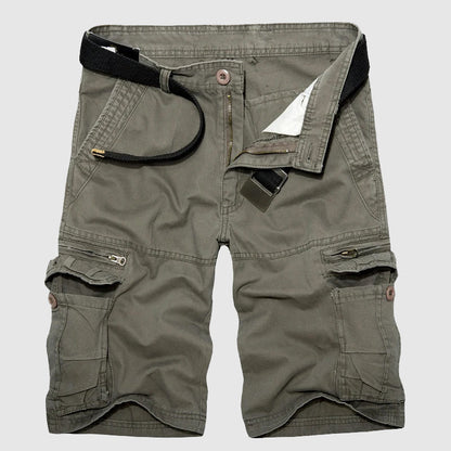 Close-up: Men's utility cargo shorts, highlighting spacious multi-pockets for travel essentials & adventure.