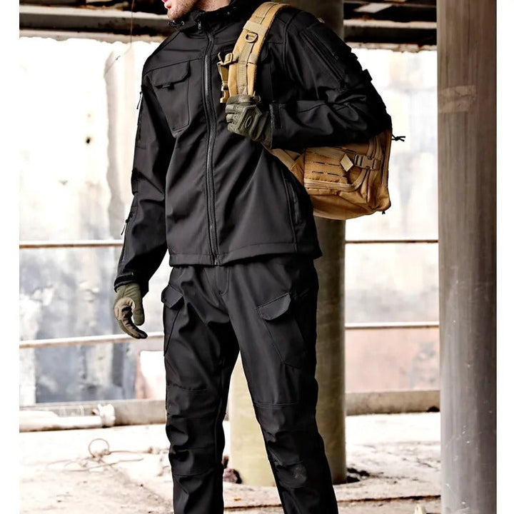 Durable men's Falk waterproof jacket & pants set. Windproof rain gear for outdoor adventures, hiking & extreme weather.