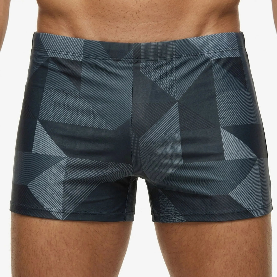 Sporty men's fitted swim trunks, perfect for beach apparel, poolside fashion, and summer essentials.