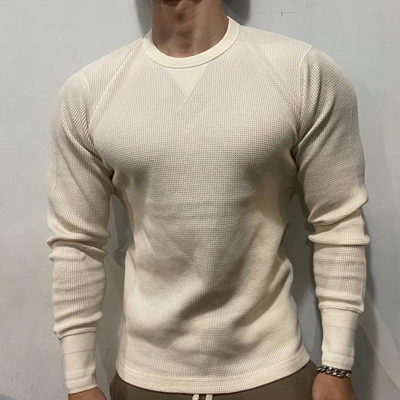 Man actively training in a performance muscle shirt, designed for gym wear, comfort, and flexibility.
