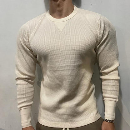 Man actively training in a performance muscle shirt, designed for gym wear, comfort, and flexibility.