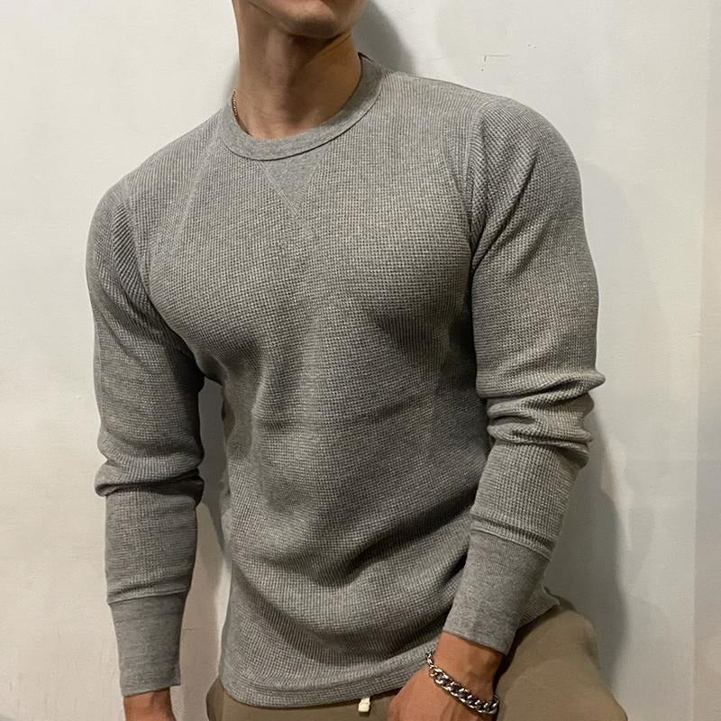 Stylish men's muscle shirt in a modern street style outfit, perfect for casual wear & athletic fashion.