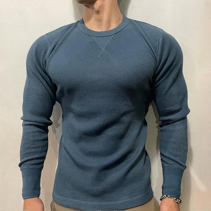 Men's versatile performance muscle shirt for gym workouts or a stylish, casual streetwear look.