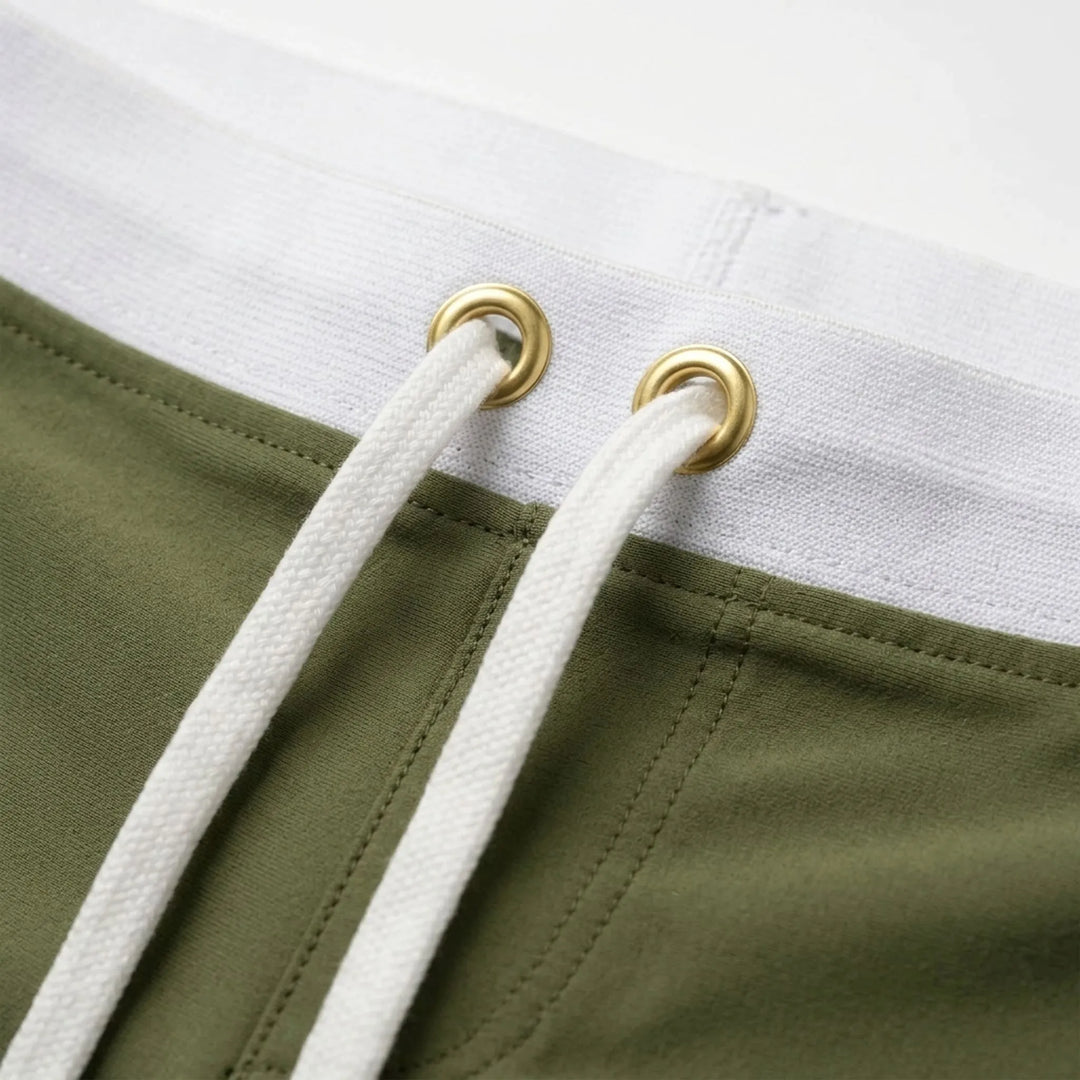 Quick-dry men's swimwear, fitted trunks ideal for swimming and beach activities.