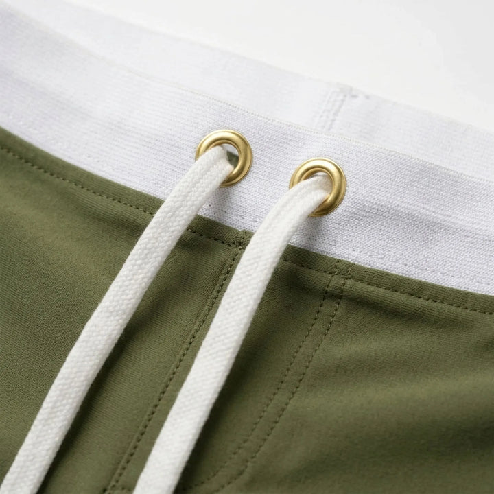 Quick-dry men's swimwear, fitted trunks ideal for swimming and beach activities.