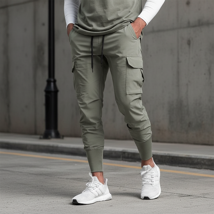 Men's flexible movement jogger pants with multiple pockets, ideal for athletic wear & casual style.