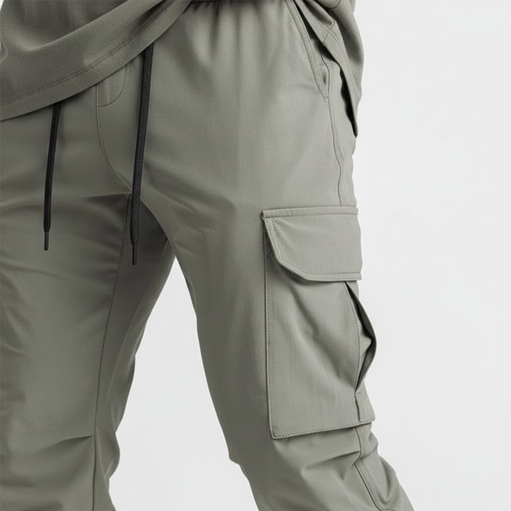 Tapered fit men's athletic joggers with flexible stretch fabric & practical cargo pockets.