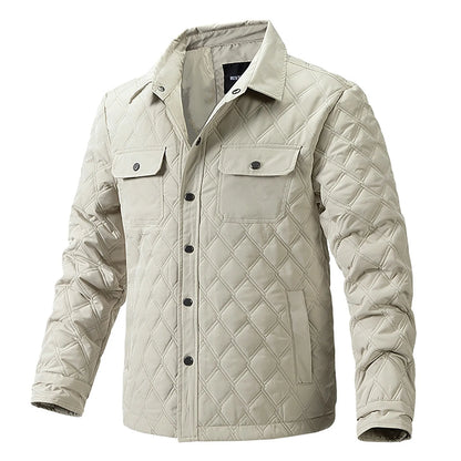 Blue men's Forge quilted jacket, rugged & stylish outerwear with snap closure & chest pockets.