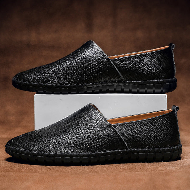 Stylish men's Fresco perforated comfort loafers, perfect for smart casual or professional attire.