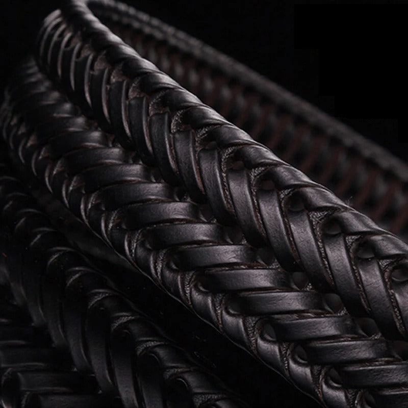 Rugged men's full-grain leather belt, intricately braided, featuring a classic brass buckle. Custom fit.