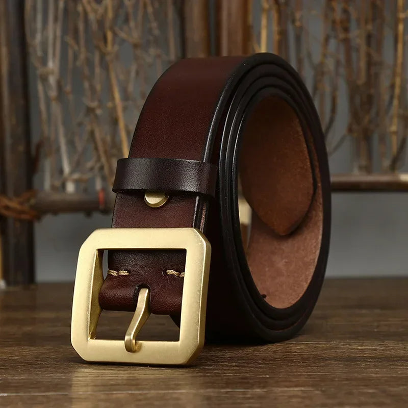 Premium men's full-grain leather belt with a gleaming solid brass buckle, a durable accessory.