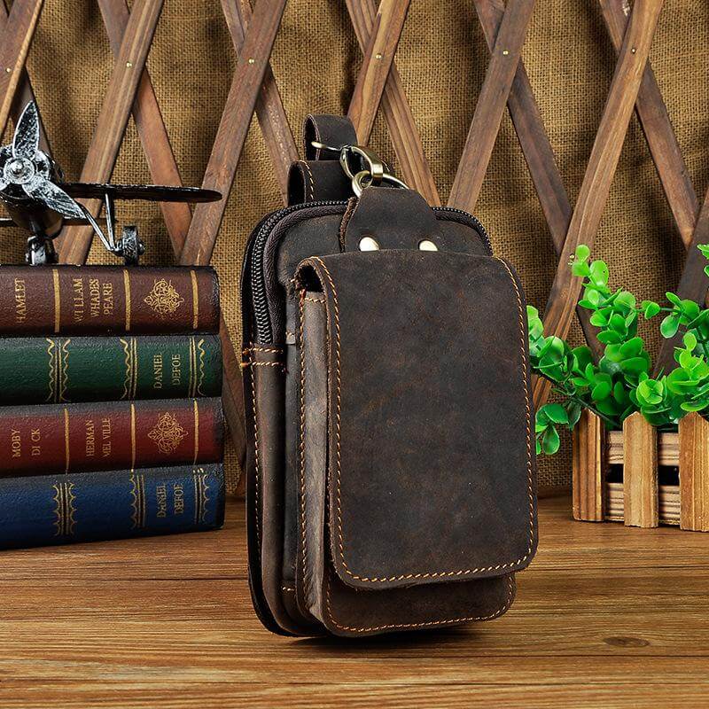 Rugged men's brown full-grain leather waist pack. Durable belt bag for travel, ideal for everyday carry.