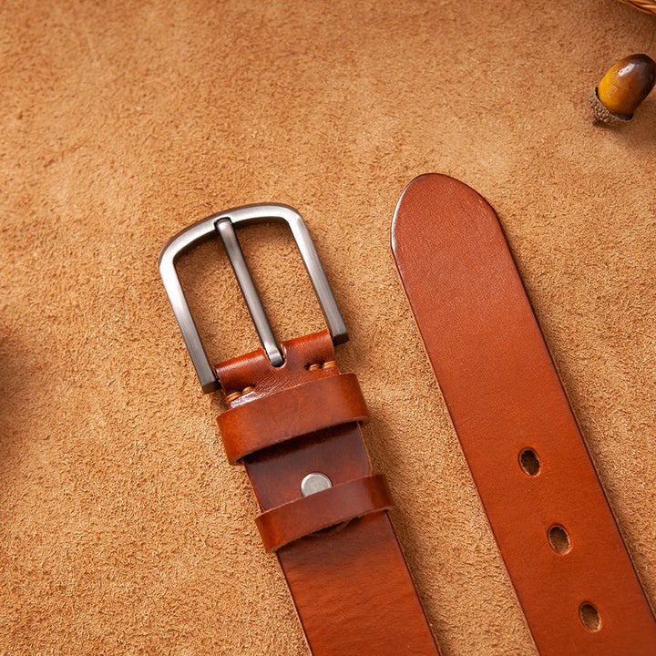 Close-up of a men's genuine leather belt showcasing its unique vintage buckle. Premium and stylish accessory.