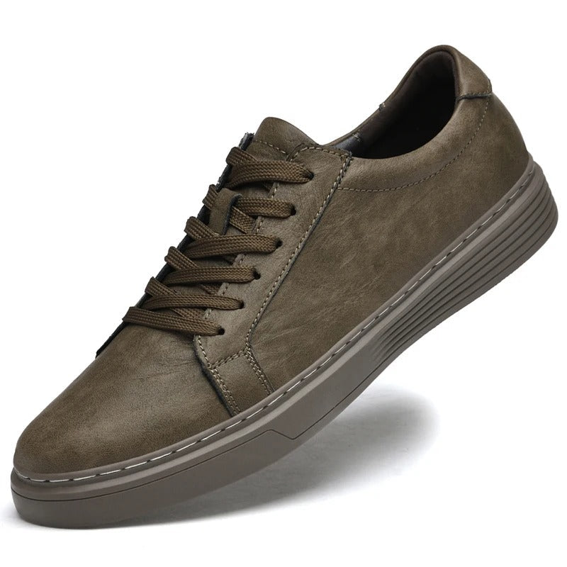 Stylish men's brown genuine leather casual sneakers, offering comfort & a durable, classic look.