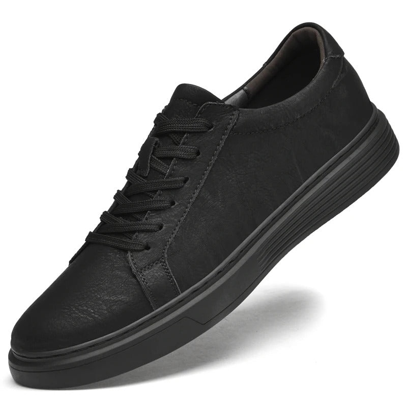 Black men's genuine leather casual sneakers. Comfortable and durable footwear for everyday wear.