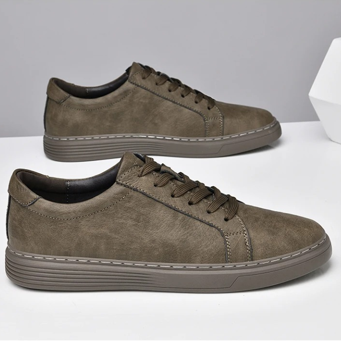 Gray men's genuine leather casual sneakers, designed for all-day comfort and a classic, durable style.