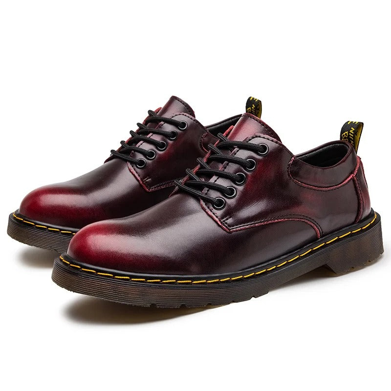 Brown genuine leather low-cut men's casual footwear. Round toe design for superior comfort and style.