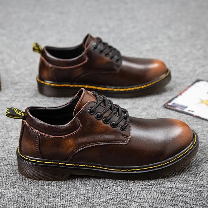 Black genuine leather men's low-cut shoes. Stylish, comfortable casual footwear for everyday fashion.