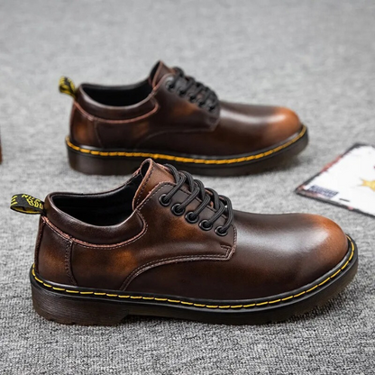 Black genuine leather men's low-cut shoes. Stylish, comfortable casual footwear for everyday fashion.