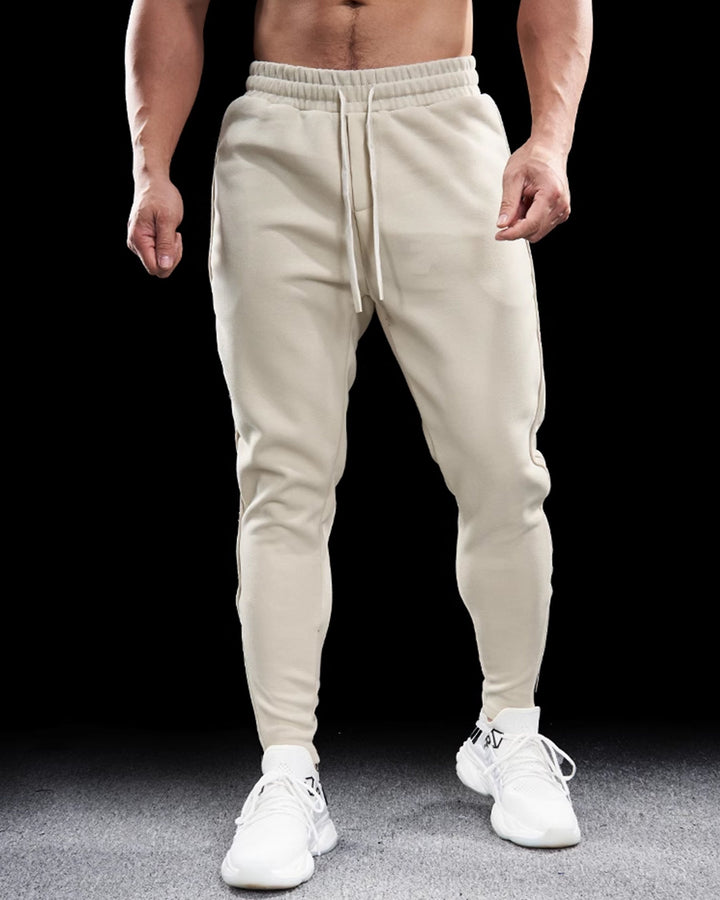 Girona Men's Joggers, activewear track pants with a modern tapered fit & zip ankles.