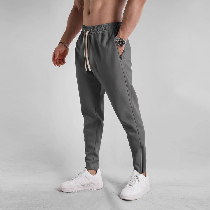 Men's Girona Zip Joggers, versatile activewear sweatpants with a fashionable tapered cut.