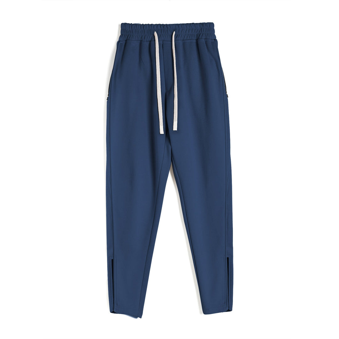 Black men's Girona Zip Joggers, sleek athletic pants with zippered hem for optimal movement.