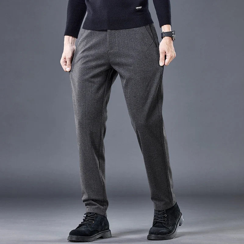 Black men's contour fit pants. Wrinkle-free stretch fabric offers tailored comfort for everyday versatile wear.