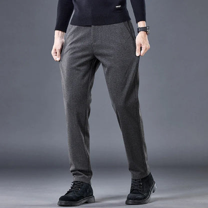Black men's contour fit pants. Wrinkle-free stretch fabric offers tailored comfort for everyday versatile wear.