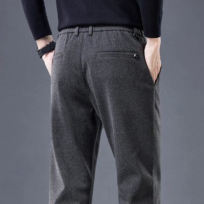 Wrinkle-free men's contour fit pants. Tailored look with stretch comfort, great for versatile everyday wear.