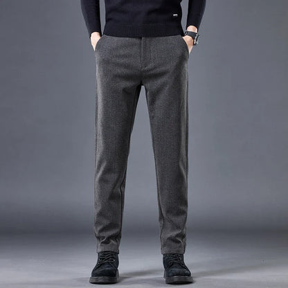 Khaki men's tailored contour fit pants. Comfortable stretch fabric provides modern style for versatile wear.