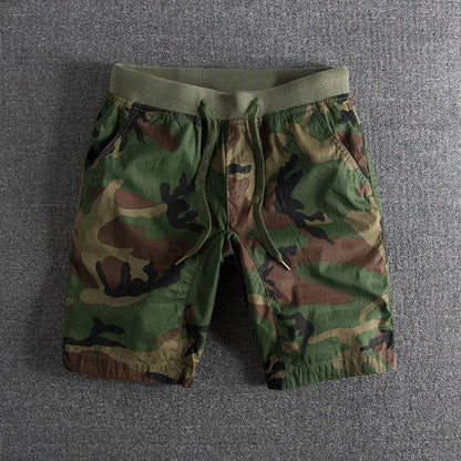 Adventure-ready men's camouflage shorts; comfortable, versatile gray & green activewear for outdoor pursuits.