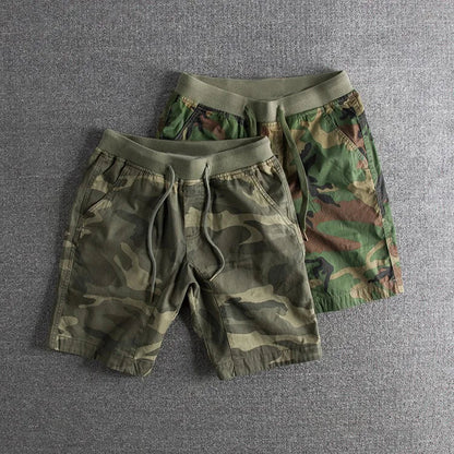 Stylish men's camo shorts with gray & green pattern, designed for comfortable activewear and outdoor versatility.