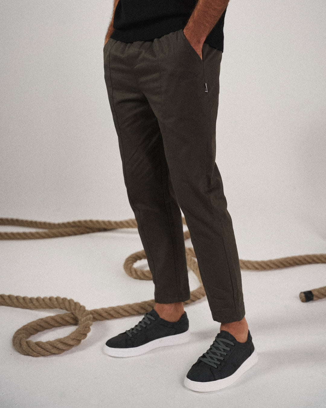 Side view of men's tapered pants, highlighting the modern tapered leg & relaxed fit for comfort & style.