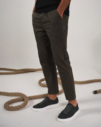 Side view of men's tapered pants, highlighting the modern tapered leg & relaxed fit for comfort & style.