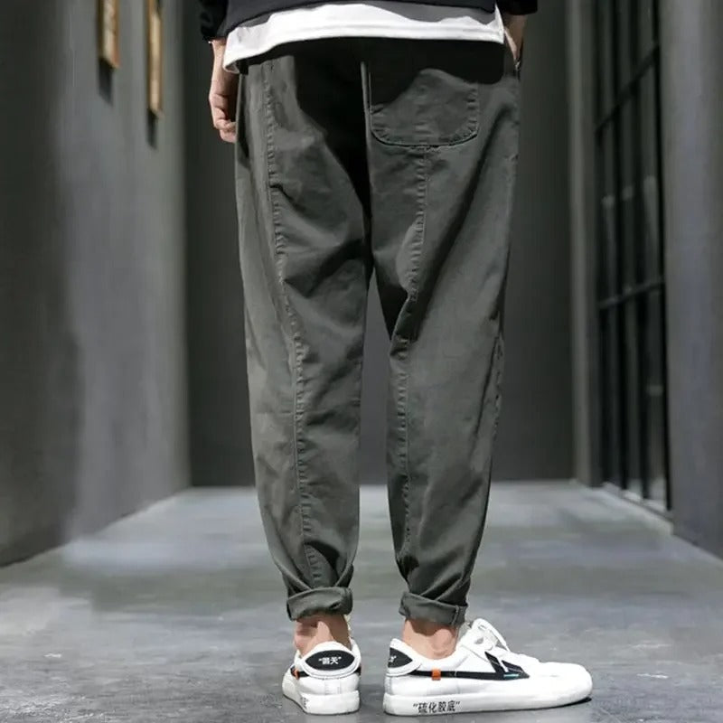 Back view of men's tapered joggers, featuring a comfortable relaxed fit & practical pockets for daily wear.