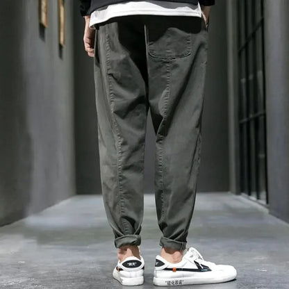 Back view of men's tapered joggers, featuring a comfortable relaxed fit & practical pockets for daily wear.