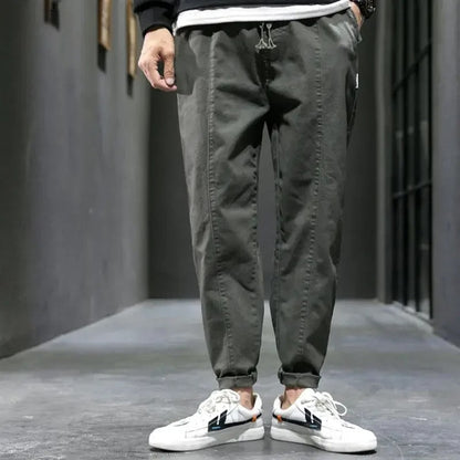 Detail of the tapered ankle cuff on men's cotton blend joggers, offering a modern look & comfortable fit.