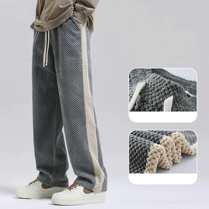 Comfortable black men's waffle knit corduroy joggers, perfect for relaxing or casual outings.