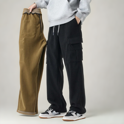 Close-up of practical utility pockets on men's stretch fabric cargo sweatpants, highlighting functional comfort wear.