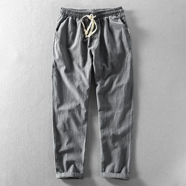 Breathable men's linen pants, relaxed fit, perfect for casual summer wear.
