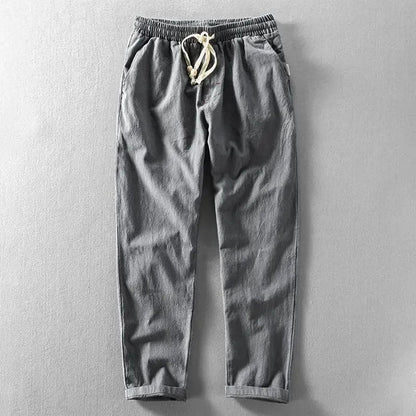 Breathable men's linen pants, relaxed fit, perfect for casual summer wear.