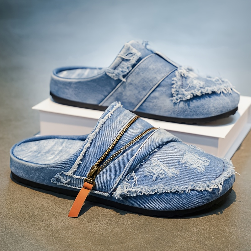 Streetwear men's slip-on mules featuring frayed edges, textured distressed fabric, and stylish zipper detail.